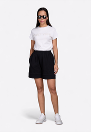 Model wearing short-sleeve off-white T-shirt, front view – East Vibe